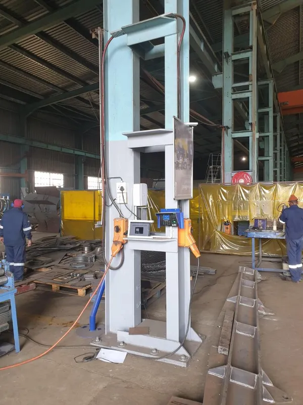 CrewPulse kiosk on a steel column in a manufacturing workshop